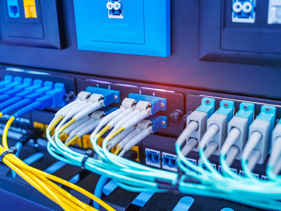 fiber optic cabling plugged into network equipment